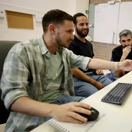 Participant during technology training with mentors at Infinity Labs